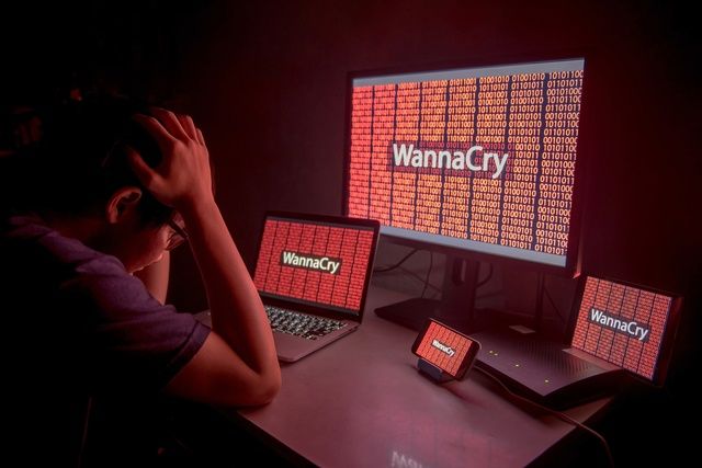 Young Asian male frustrated by WannaCry ransomware attack